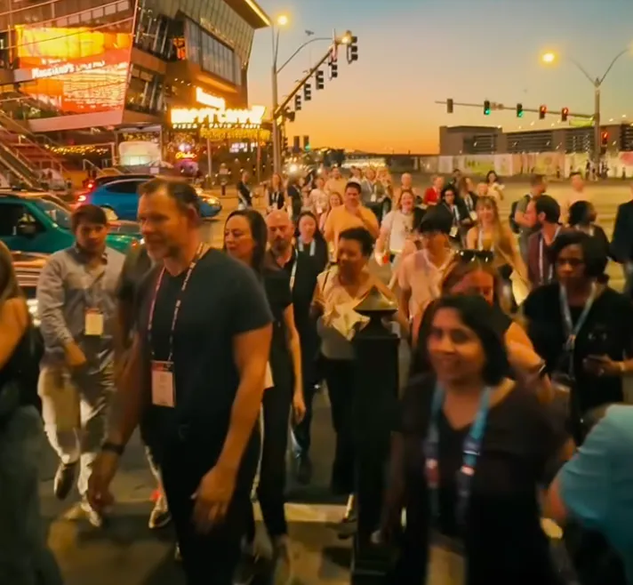 Transform 2026 attendees walking at sunset